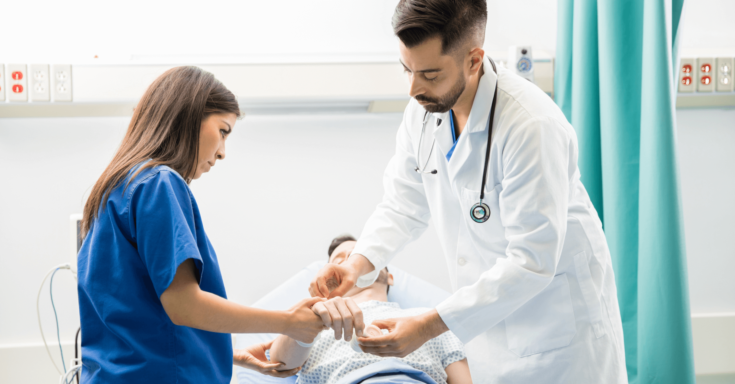 New residents exam a patient in the clinic.