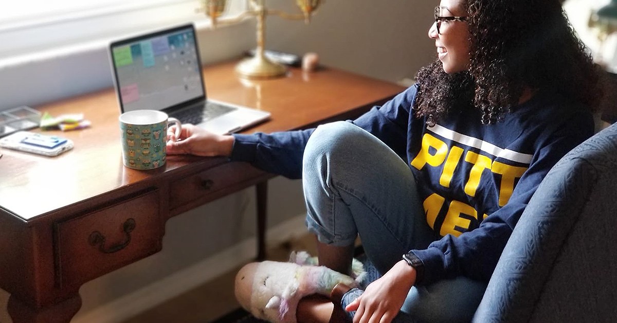 Med student sits at her desk as she practices med schooling from home