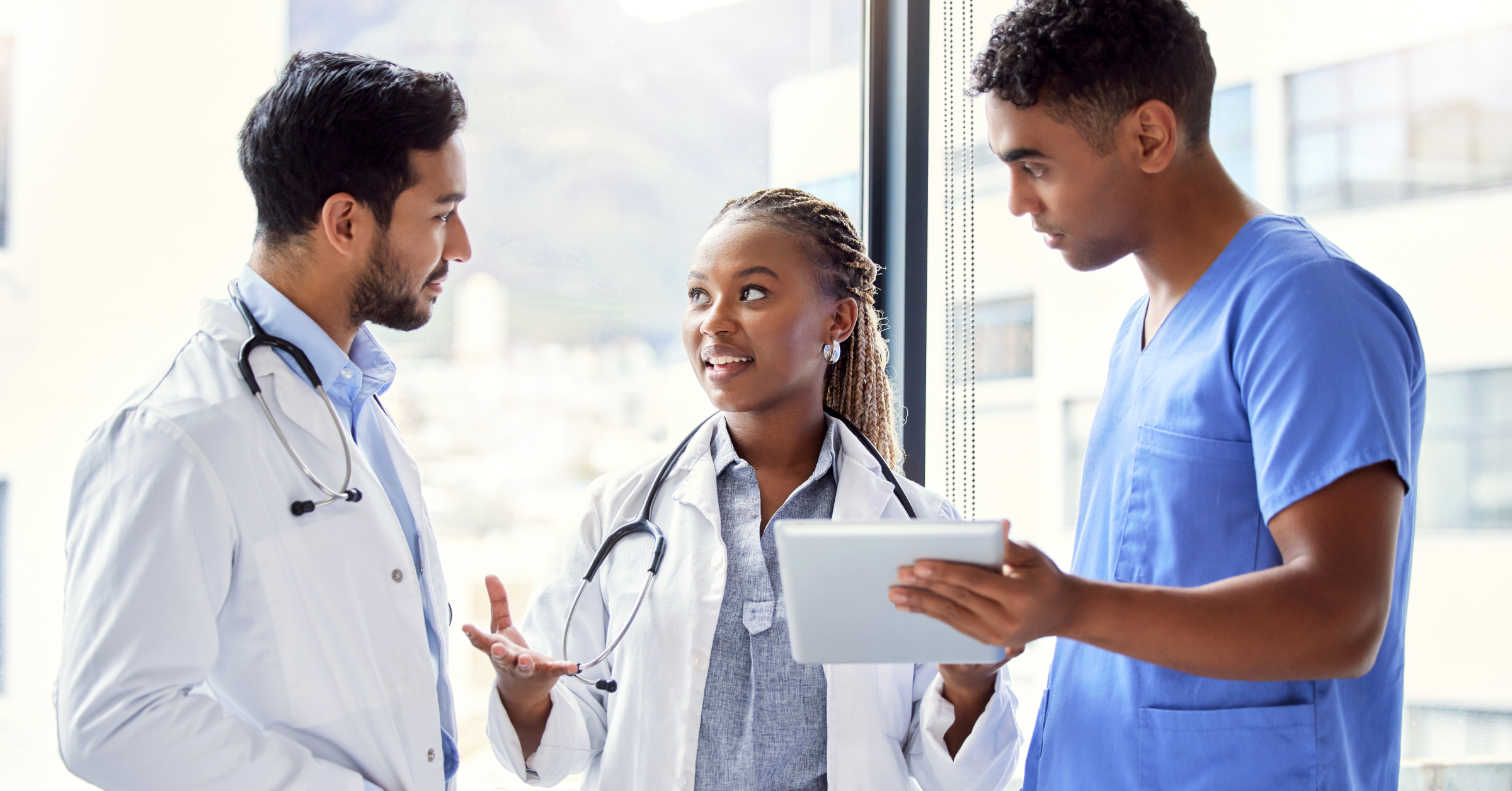 Three young doctors in conversation