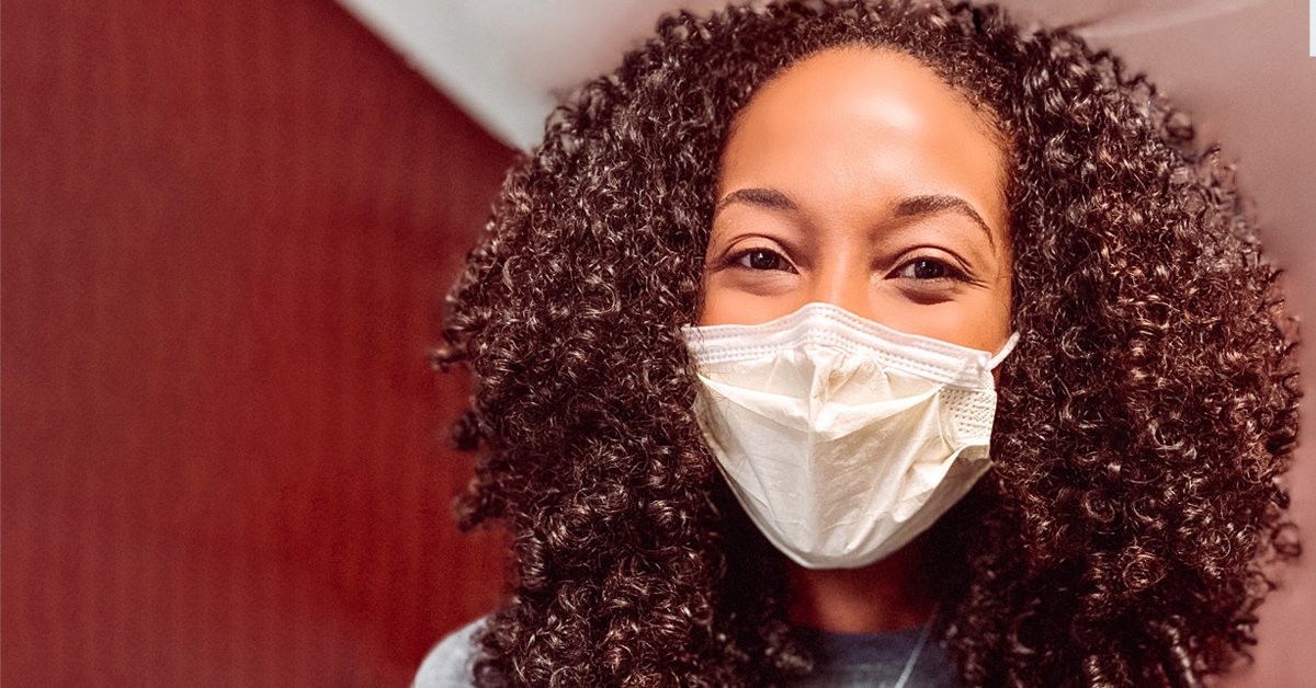 Medical student on the wards wearing mask.