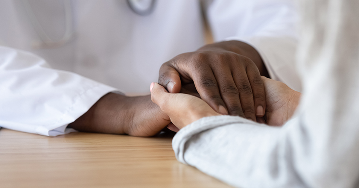 An upclose shot of two people holding hands 